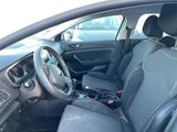 the interior of a car with a black leather seat and a steering wheel