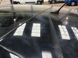 a car that is parked in a parking lot with other cars