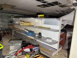 a room that has a bunch of shelves in it