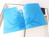 a open book with a picture of a plant on it