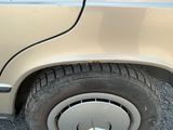a close up of a car ' s tire with a sticker on it
