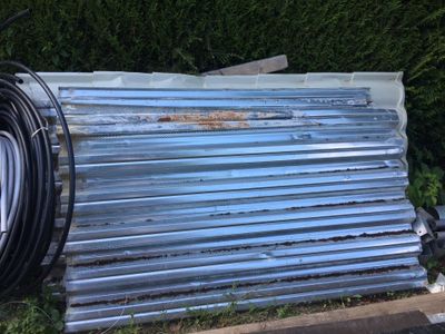 an image of a metal roof with a hose attached to it