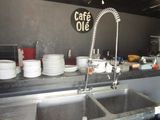 a picture of a kitchen with a lot of dishes on the counter