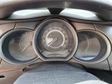 a close up of a car dashboard with a speedometer and gauges