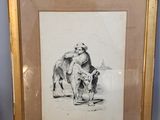painting of a dog and a cat in a frame on a table