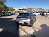 a silver car parked in a parking lot next to other cars