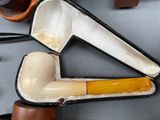 a pipe and a pipe holder sitting on a table
