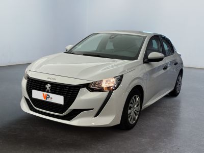 the white car is parked in a large room with a black floor