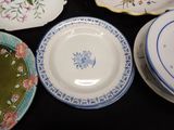 many plates that are sitting on a black table