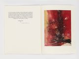un livre ouvert sur lequel figurent l'image d'un arbre et un poème