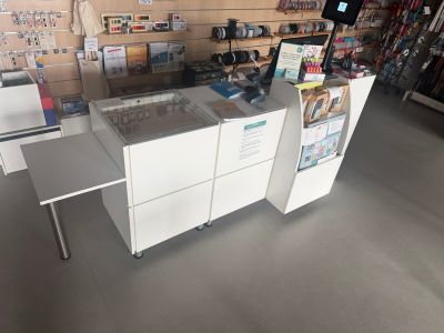 an image of a store with a counter and a printer