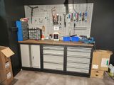 a workbench with many tools on it in a garage
