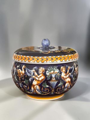 a bowl with a lid that has a design on it
