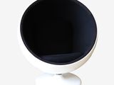 an image of a black and white chair with a white base