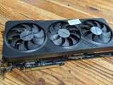 a close up of a video card sitting on top of a wooden table
