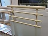 a picture of a glass and metal rack in a room