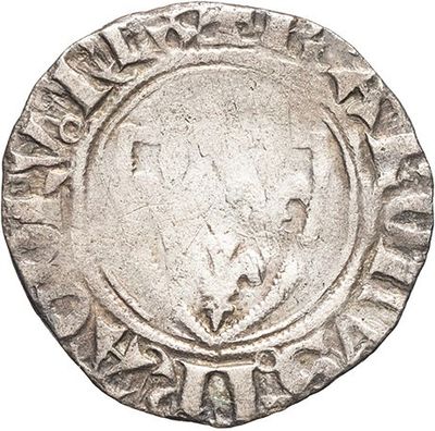 an old silver coin with a bird on it