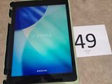 a tablet that is sitting on the floor next to a price tag