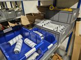 many rolls of toilet paper sitting in a blue bin