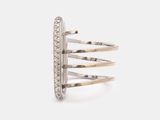 a close up of a silver ring with diamonds on a white background