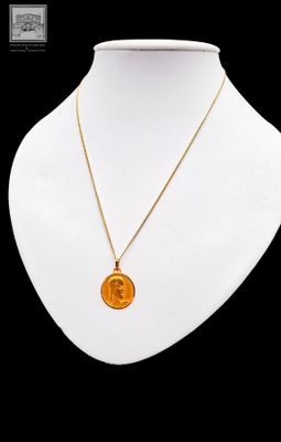 a close up of a necklace on a mannequin mannequin