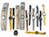 a lot of watches that are lined up on the table