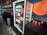 a refrigerator that is sitting in the middle of a room