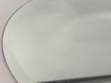 a close up of a white plate with a knife on it