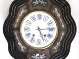 a clock that is hanging on the wall in the room