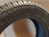 a close up of a tire on a cardboard box with a box in the background