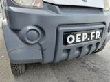 a close up of the front bumper of a small car