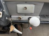 a close up of a car dashboard with a key on it