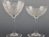 pair of etched glass goblets with raised rims