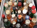 many bottles of alcohol in the bins on the table
