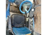 a picture of a seat and steering of a tractor
