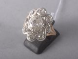 an image of a diamond ring on a black stand