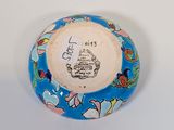 a blue and white plate with a picture of a castle on it