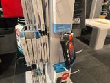 a lot of electronic devices on display in a store