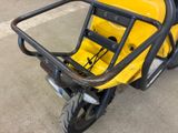 a yellow motorcycle with a black seat and a black handlebar