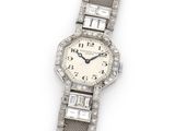 a close up of a watch on a white surface with a white background