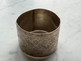 a silver cup that is sitting on a table