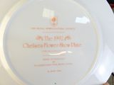 a white plate with a red and orange design on it