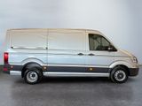 a silver van that is parked in a room