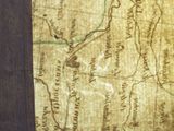 a close up of an old map on a table