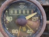 a close up of an old car ' s speedometer