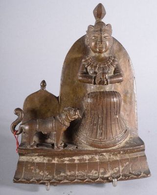 statue of a woman with a dog and a cat on a table