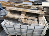 several pallets of wood are stacked on top of a pallet