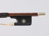 an image of a violin bow with a wooden handle on a white background