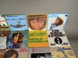 many different types of vinyl records on the table