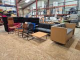 a lot of furniture in a warehouse with a lot of shelves